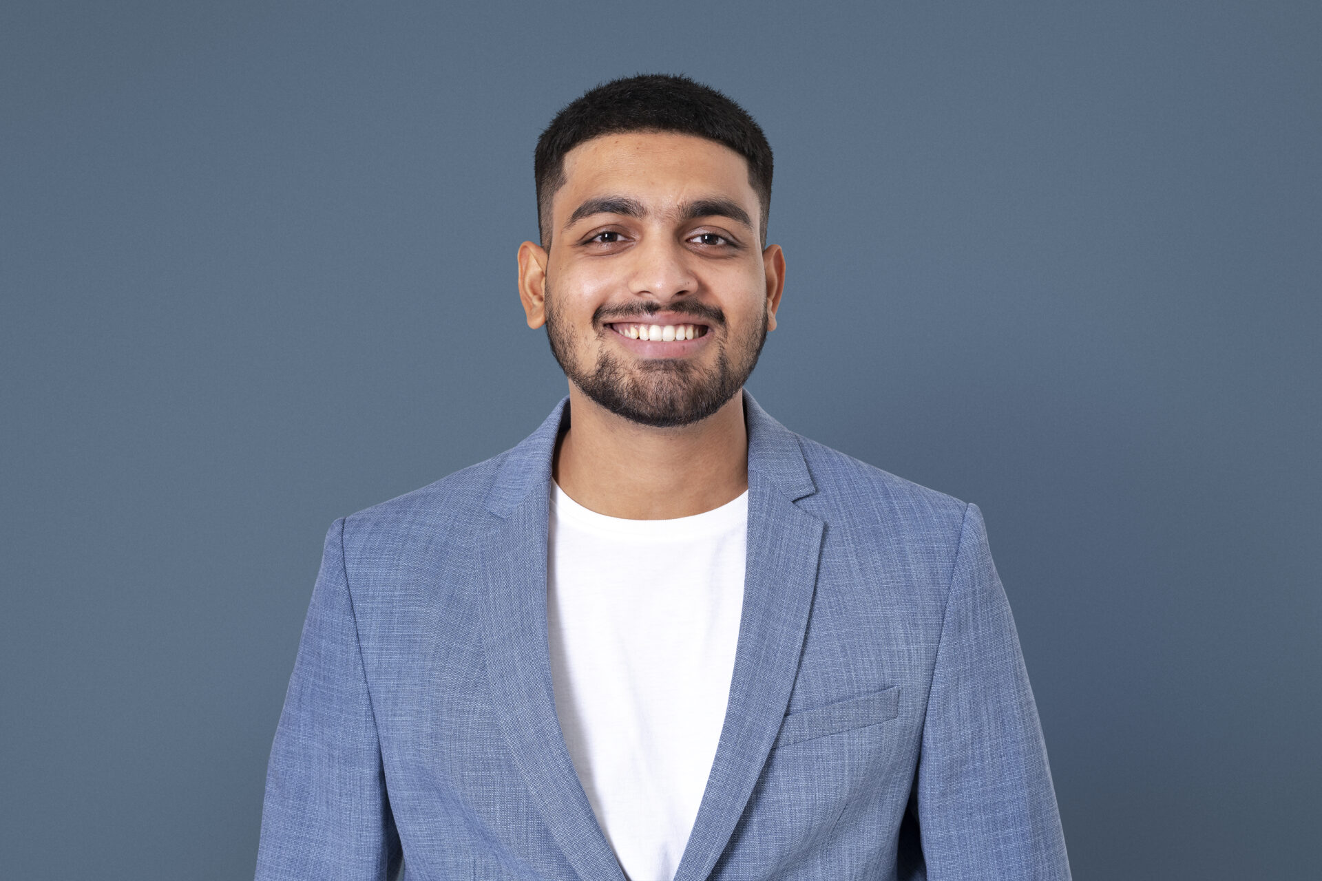 Cheerful Indian businessman smiling closeup portrait for jobs and career campaign