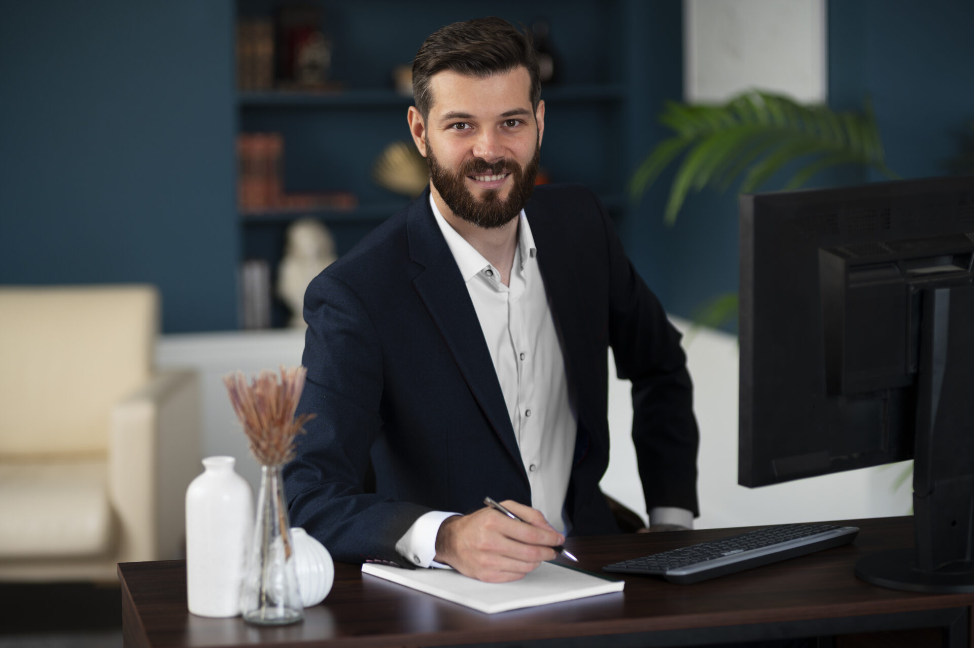 medium-shot-smiley-man-sitting-desk